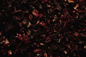 A detailed close-up image showcasing the rich texture of dried hibiscus flowers.